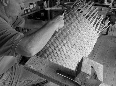 Stephen Zeh carving a basket handle at his shaving horse