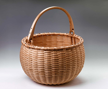 Swing Handle Apple Basket - hand woven of brown (black) ash. Hand crafted by Stephen Zeh, Maine basketmaker