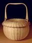 Covered Swing Handle Basket hand woven of fine brown ash