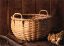 Muffin Basket with morel mushrooms. Handwoven of pounded brown or black ash by Stephen Zeh, basketmaker of Temple, Maine. The handles and rims are hand split and carved.