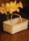 Tea Basket with daffodils. Hand crafted of brown or black ash by Stephen Zeh, Basketmaker of Temple, Maine.
