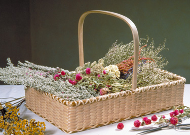 Sweetgrass Flower Tray with dried flowers hand crafted of brown (black) ash and sweet grass by Stephen Zeh basket maker of Temple, Maine.