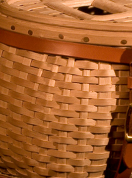 Closeup of weaving on the Trout Creel, a fishing creel basket handcrafted of brown ash and leather by Stephen Zeh