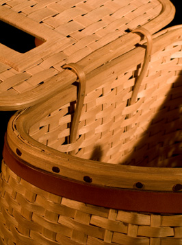 Trout Creel showing inside cover. A fishing creel basket handcrafted of brown ash and leather by Stephen Zeh