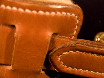 Trout Creel, detail showing leather and shearling shoulder pad. A fishing creel basket handcrafted of brown ash and leather by Stephen Zeh