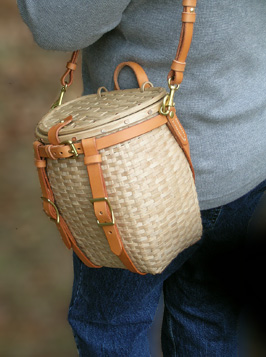 Maine Packbasket Purse worn at side - brown ash, brass, leather - by Stephen Zeh