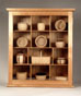 Display case for small collectibles in butternut